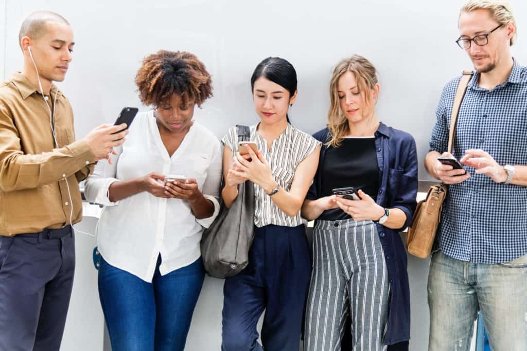 Five people with smartphones