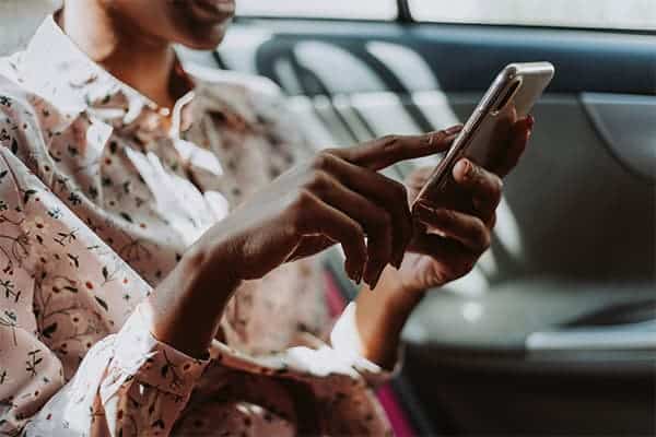 woman checking email on smartphone